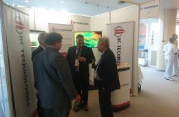Mr. Steve Sawdon with visitors at the IIC Technologies stand, in IHO assembly, Monaco