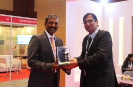 Mr. Rajesh Alla, CMD IIC Technologies being presented with "The Great Theodolite" by Mr. Swarna Subba Rao, Surveyor General of India, at the Geospatial World Forum 2017.